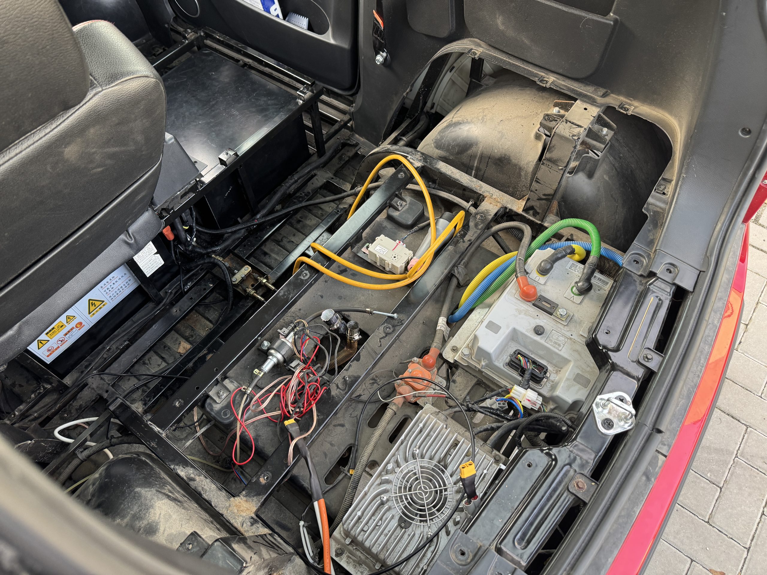 High-voltage battery repair: checking the BMS board and connectors during EV traction pack repair
