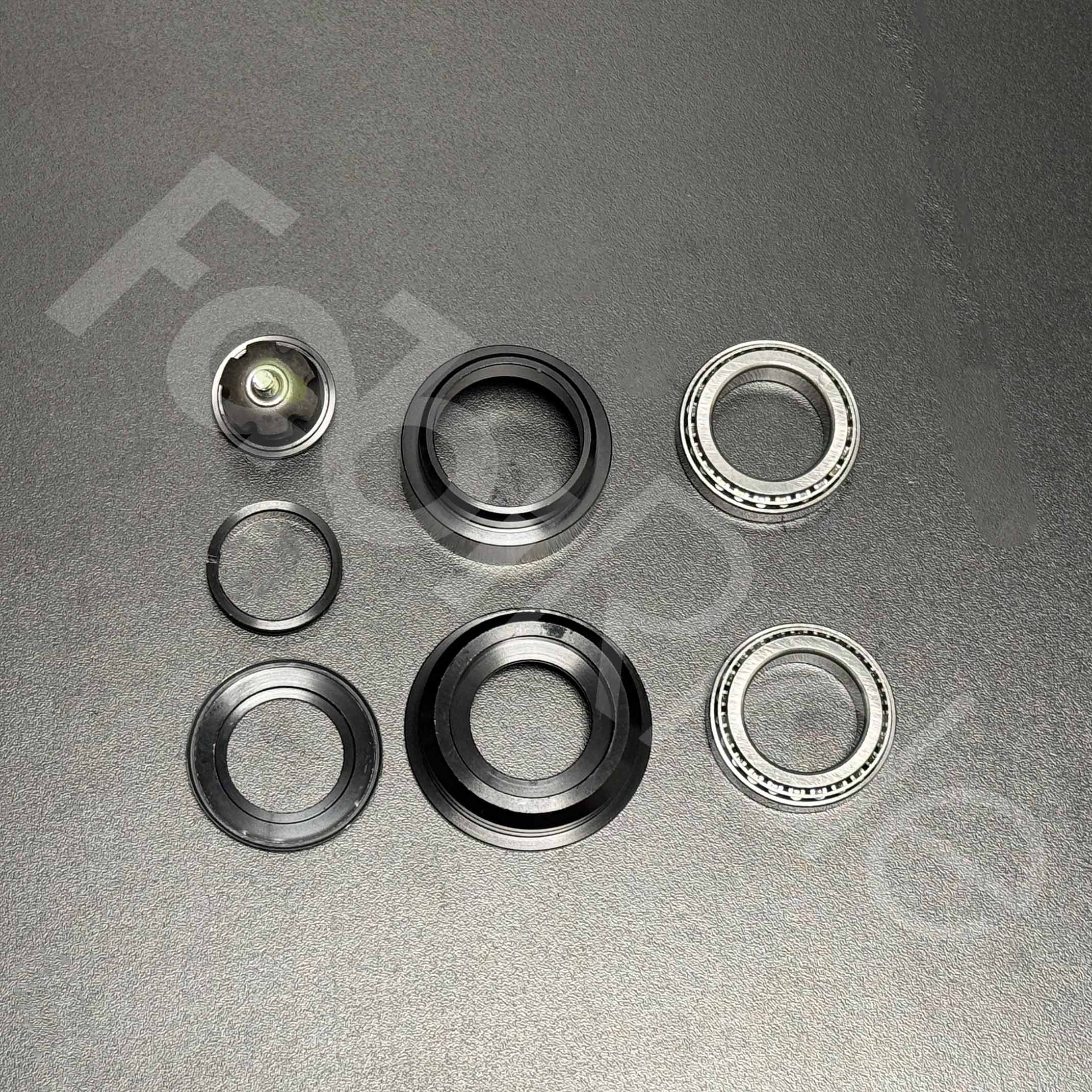 Upper and lower tapered bearings with bearing races from the Light Bee headset kit